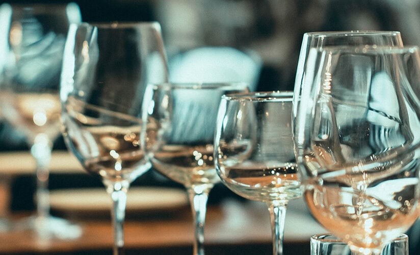 Elegant wine glasses for tasting at Olio event.