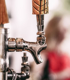 Close-up of a water tap with a blurred background.